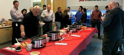 Komatsu employees hosting a chili cook off