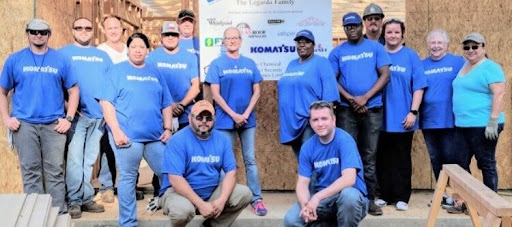 Four Komatsu employees at golf fundraising event