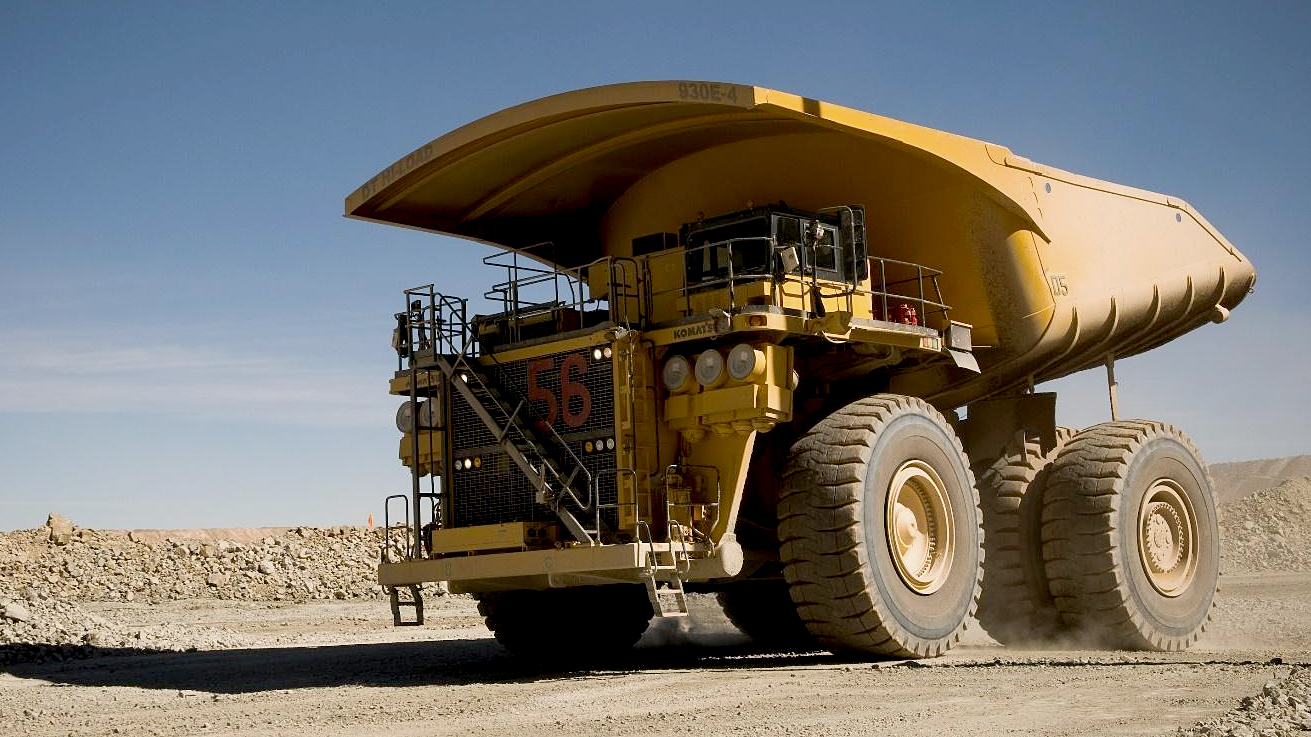 A komatsu 930E mining truck with DT Hi-Load dump truck body carrying a full load.