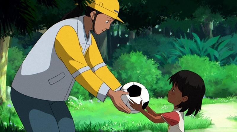 Group of elementary school students walking outdoors with a teacher in uniform